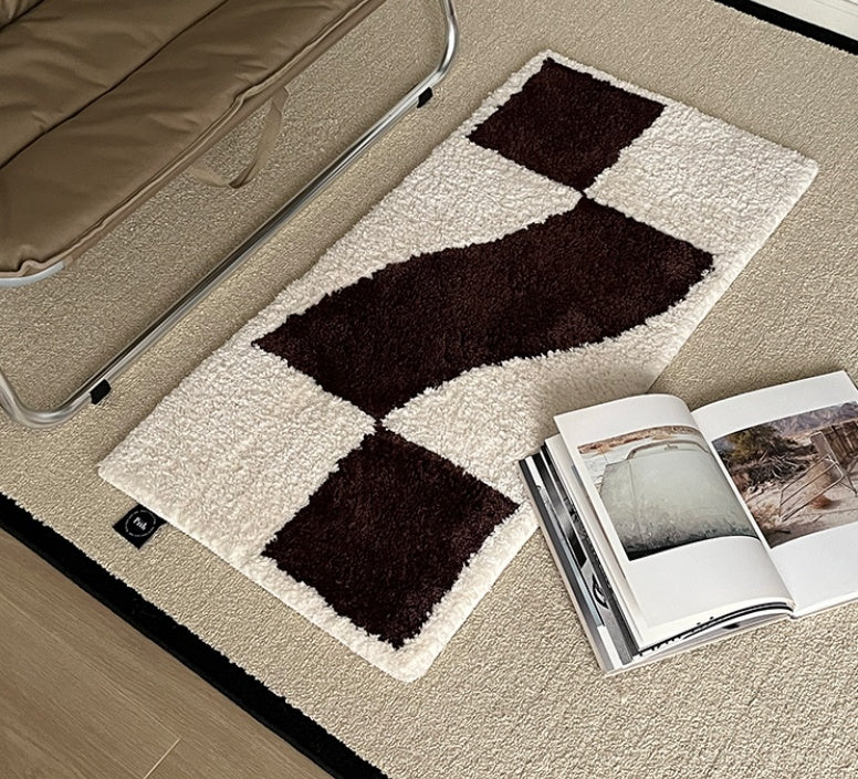 Checkered flocked home carpet in a minimalist living room with a soft grey and white pattern

