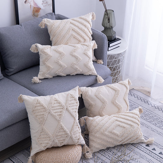 Boho tufted pillow cushion cover on a neutral-toned sofa with textured detailing

