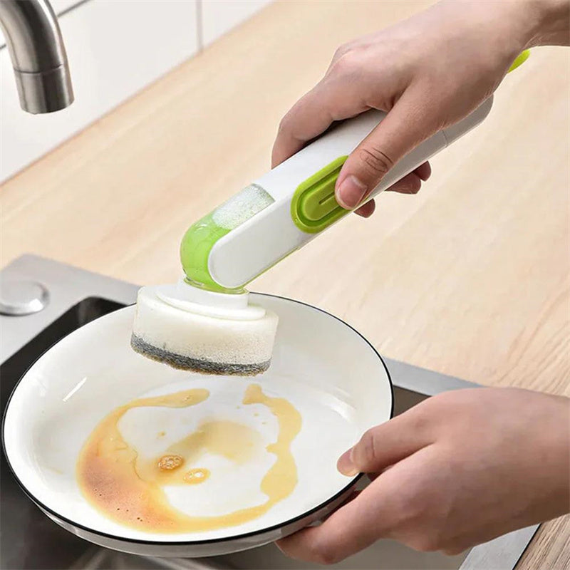 Multi-functional kitchen cleaning brush with long handle and liquid dispenser.