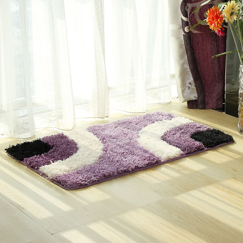 Textured tufted carpet laid in a cozy living room with neutral furniture and soft lighting

