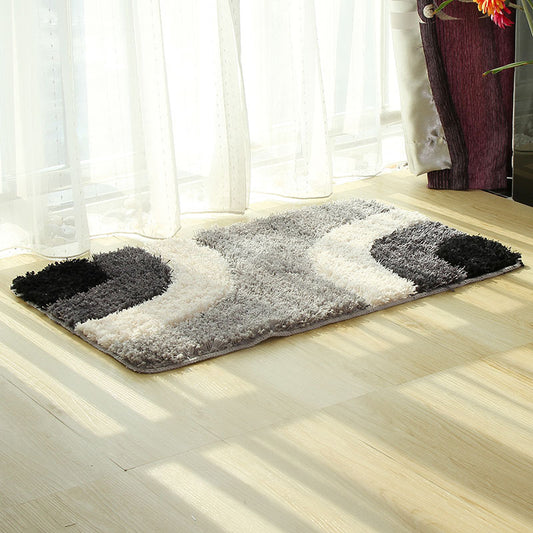 Textured tufted carpet laid in a cozy living room with neutral furniture and soft lighting

