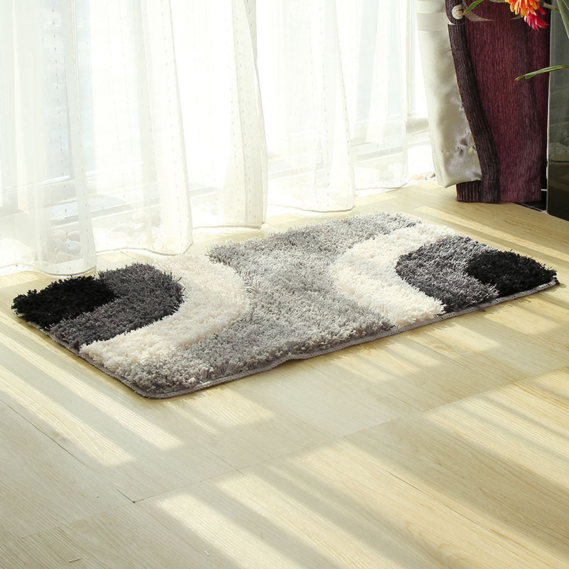 Textured tufted carpet laid in a cozy living room with neutral furniture and soft lighting

