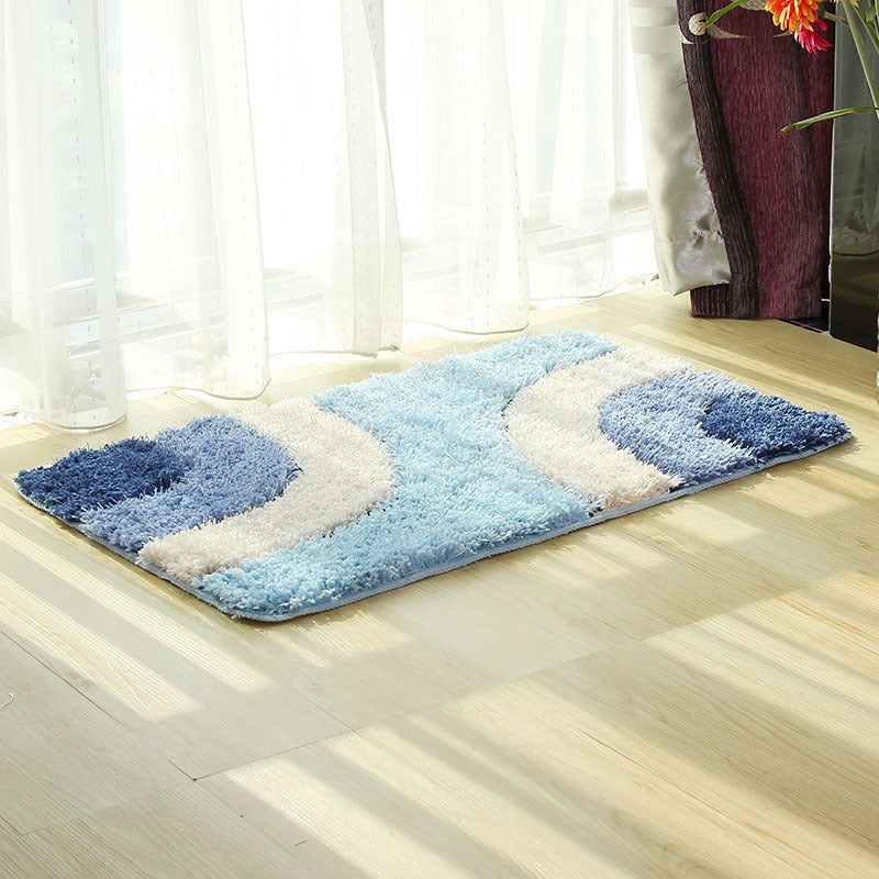 Textured tufted carpet laid in a cozy living room with neutral furniture and soft lighting

