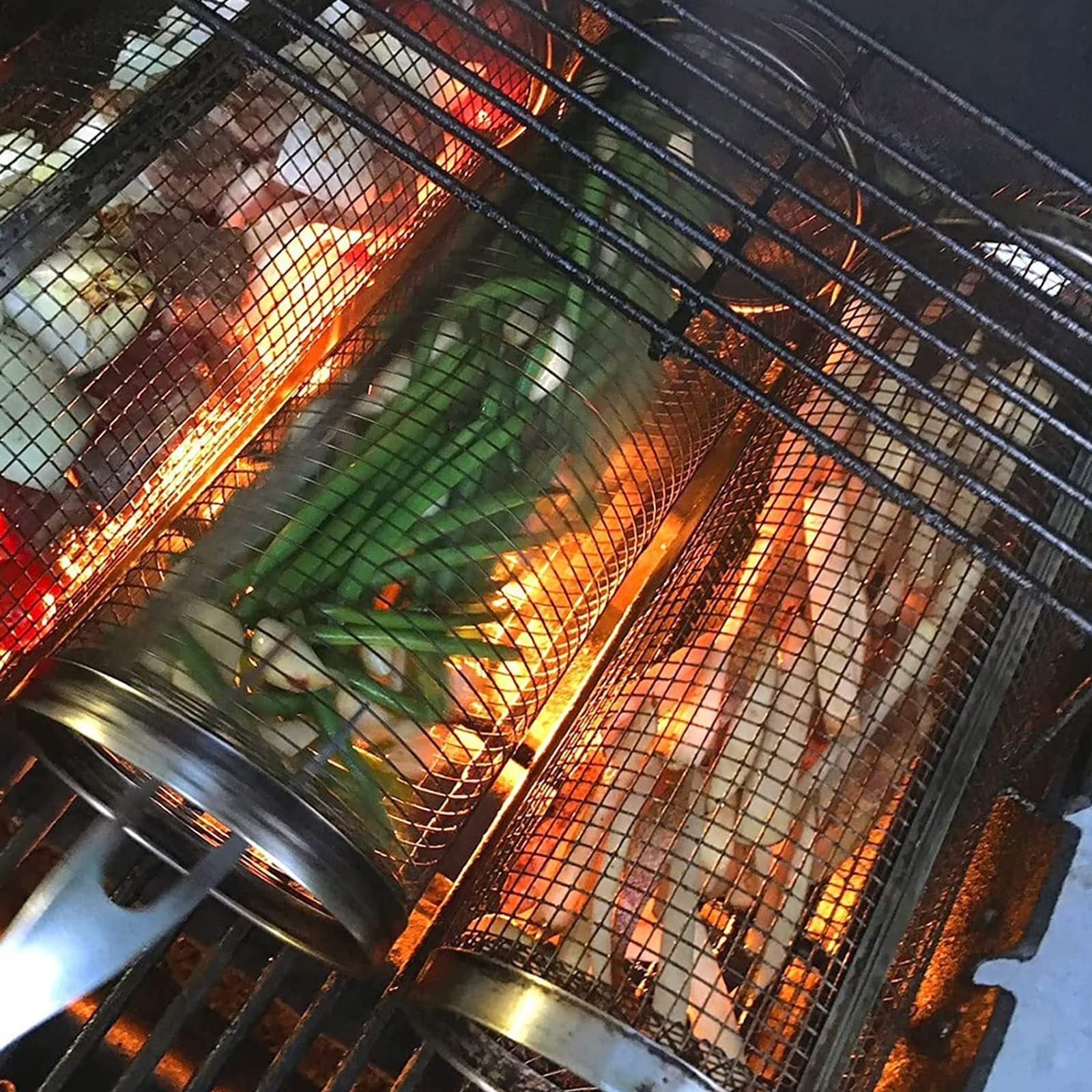 Portable rolling grilling basket for BBQ and outdoor cooking.