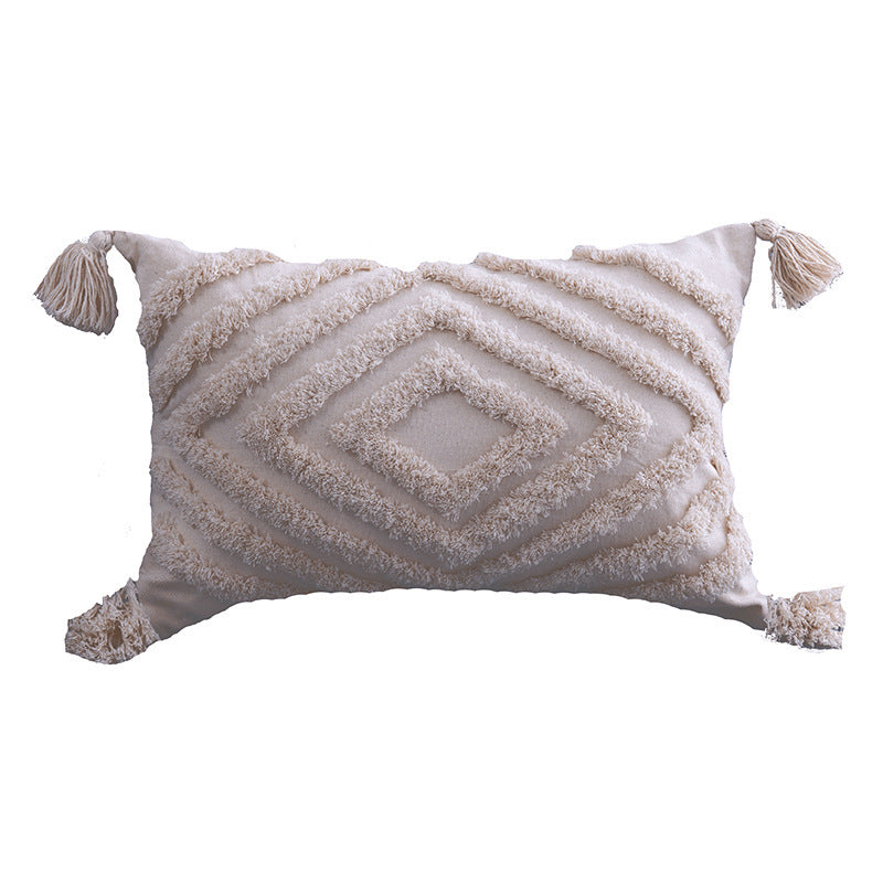 Boho tufted pillow cushion cover on a neutral-toned sofa with textured detailing

