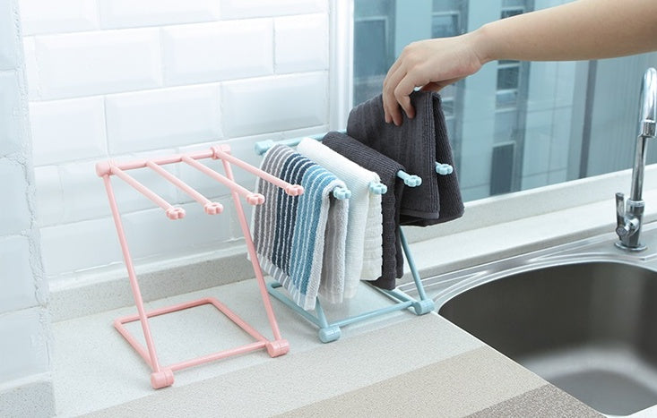 Foldable dishcloth shelf and organizer for modern kitchen spaces.