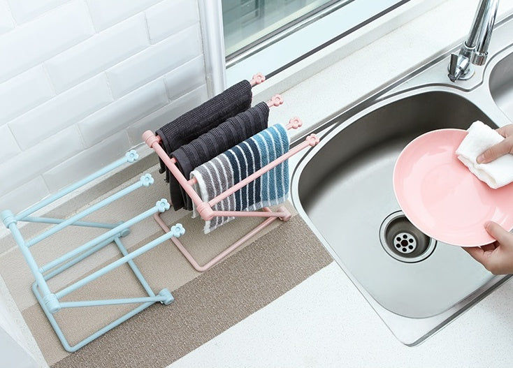 Foldable dishcloth shelf and organizer for modern kitchen spaces.