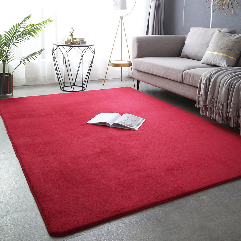 Modern minimalist coral fleece carpet in a bright living room with neutral-toned furniture and natural light

