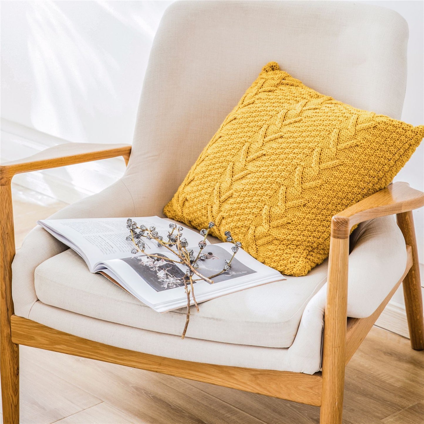 Thick wool knitted pillowcase with chunky knit pattern on a cozy sofa

