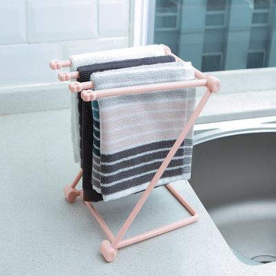 Foldable dishcloth shelf and organizer for modern kitchen spaces.