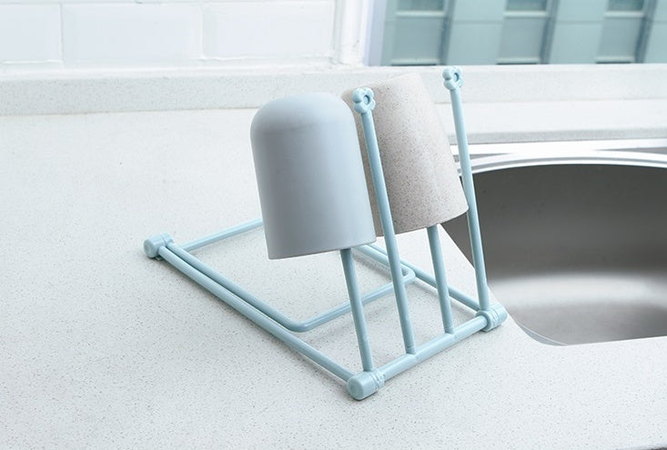 Foldable dishcloth shelf and organizer for modern kitchen spaces.
