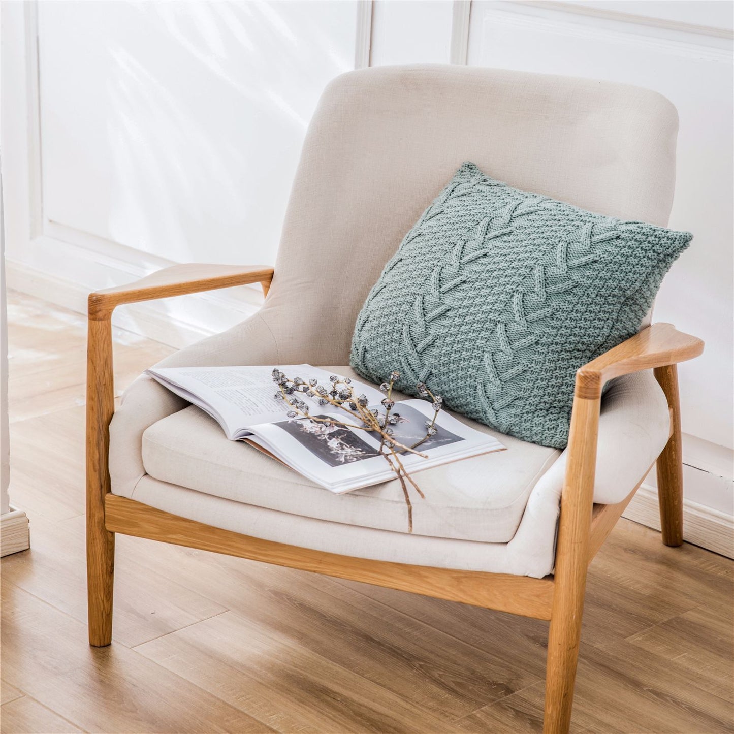 Thick wool knitted pillowcase with chunky knit pattern on a cozy sofa


