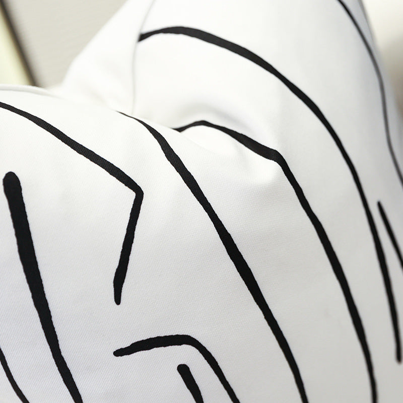 Nordic-style decorative cushion on a minimalist sofa with neutral tones

