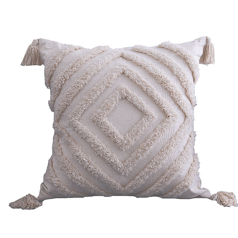 Boho tufted pillow cushion cover on a neutral-toned sofa with textured detailing

