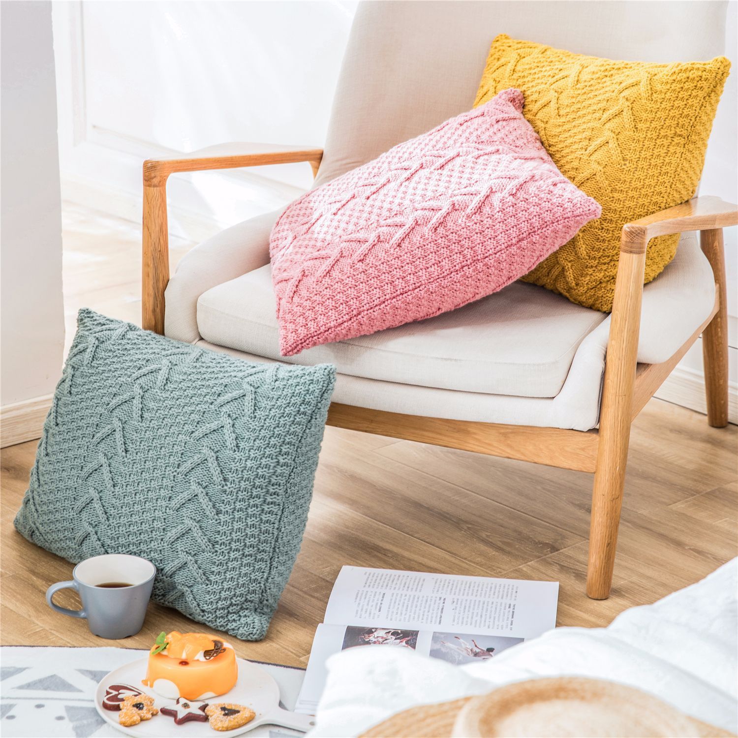 Thick wool knitted pillowcase with chunky knit pattern on a cozy sofa

