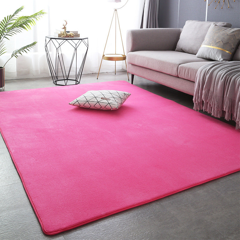 Modern minimalist coral fleece carpet in a bright living room with neutral-toned furniture and natural light

