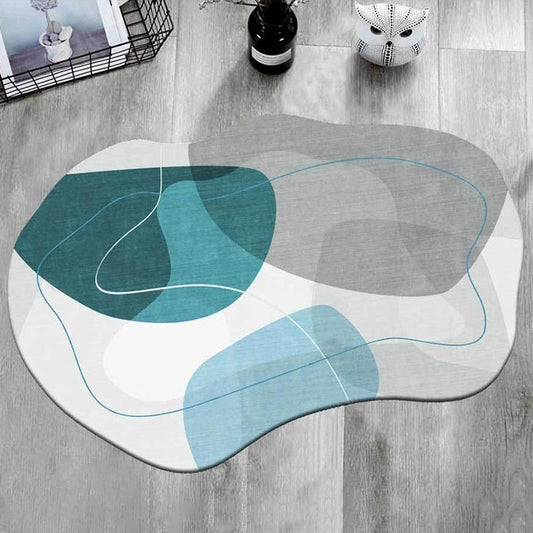 Irregular shaped carpet placed under a coffee table in a modern living room with artistic décor

