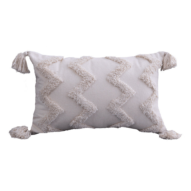 Boho tufted pillow cushion cover on a neutral-toned sofa with textured detailing

