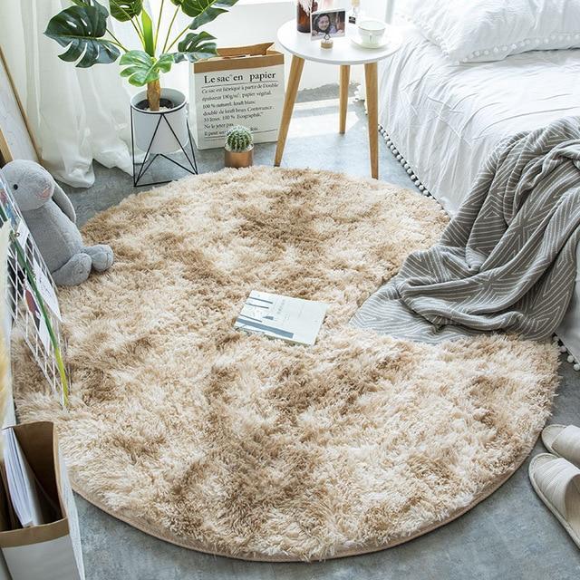 Nordic round silk wool carpet placed in a minimalist living room with natural light and cozy furniture

