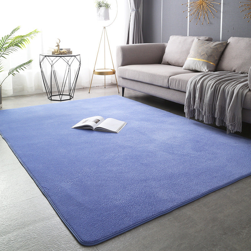 Modern minimalist coral fleece carpet in a bright living room with neutral-toned furniture and natural light

