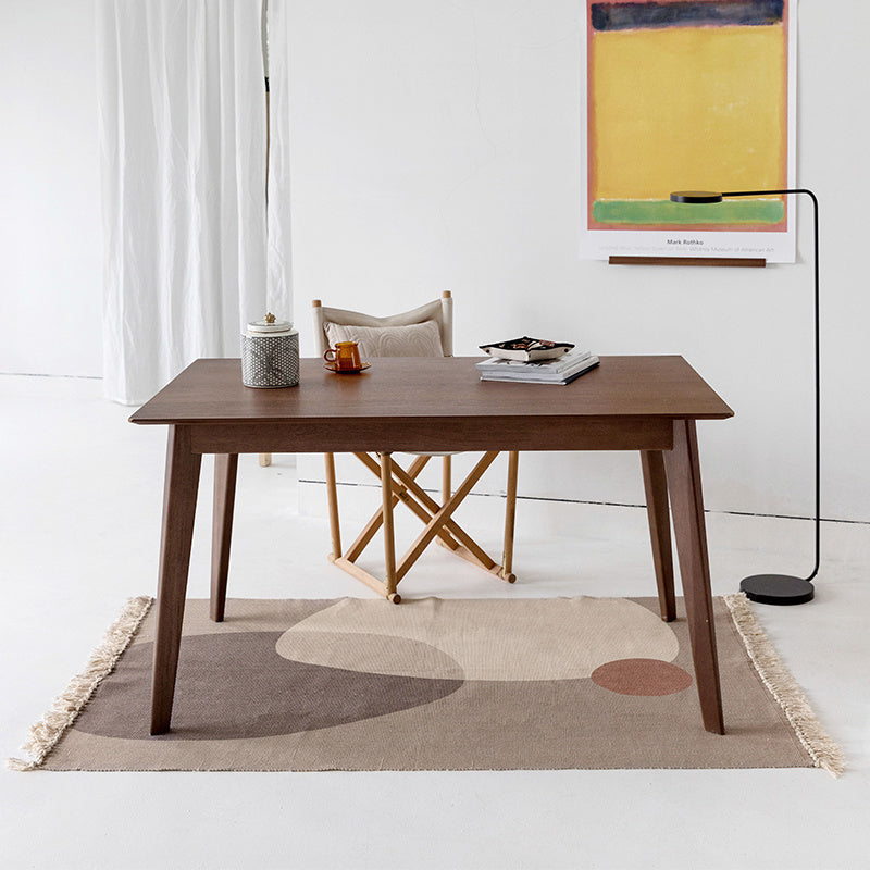 Small floor mat placed beside a living room sofa and coffee table in a modern, cozy space

