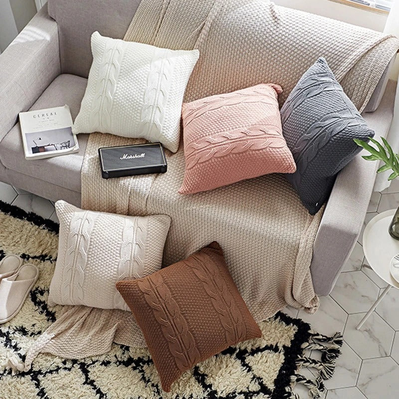 Natural wool pillow placed on a bed with neutral, minimalist bedding

