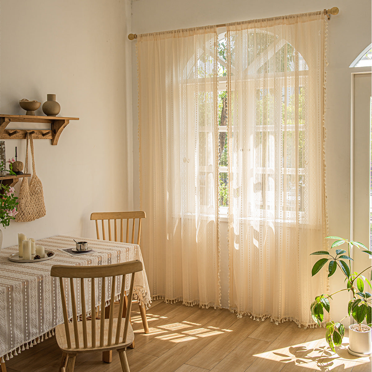 Wood color lace curtain hanging as window screen in a cozy living room

