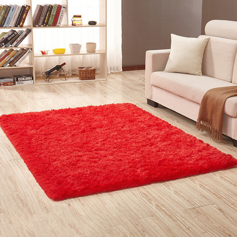 Soft carpet placed under a coffee table and beside a sofa in a cozy living room with neutral tones

