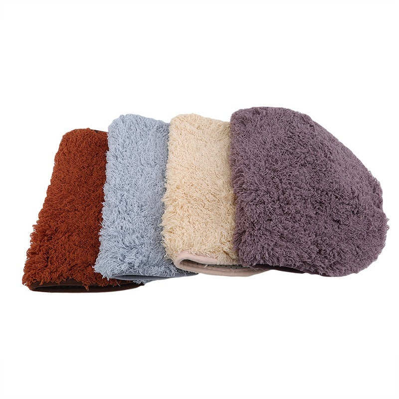 Oval-shaped absorbent carpet in a modern living room with light furniture and natural lighting

