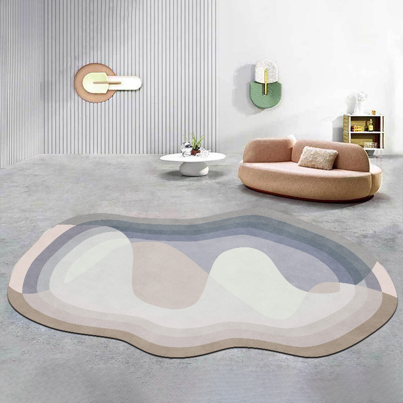 Irregular shaped carpet placed under a coffee table in a modern living room with artistic décor

