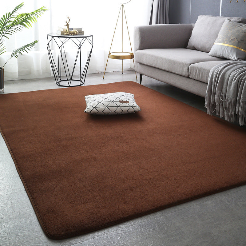 Modern minimalist coral fleece carpet in a bright living room with neutral-toned furniture and natural light

