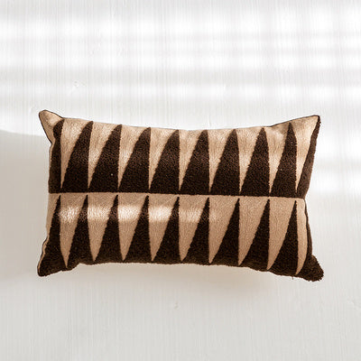 Nordic-style decorative cushion on a minimalist sofa with neutral tones


