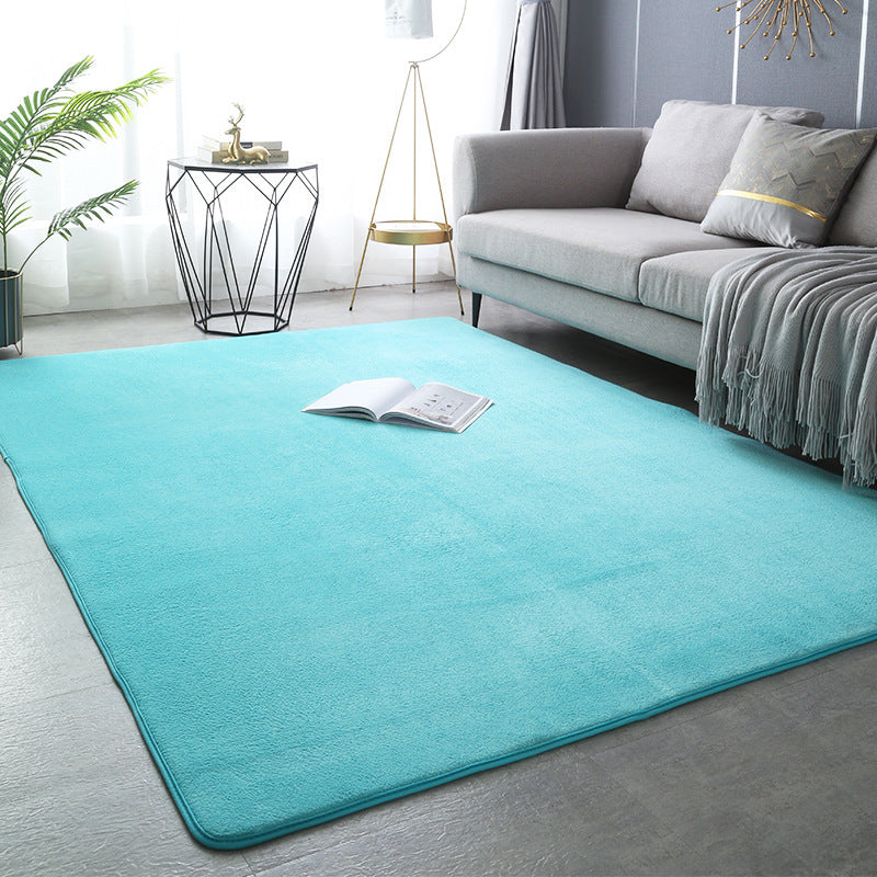 Modern minimalist coral fleece carpet in a bright living room with neutral-toned furniture and natural light


