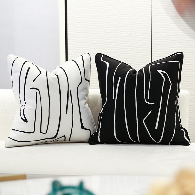 Nordic-style decorative cushion on a minimalist sofa with neutral tones

