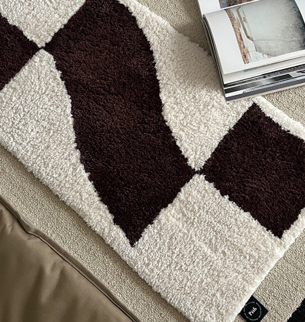Checkered flocked home carpet in a minimalist living room with a soft grey and white pattern

