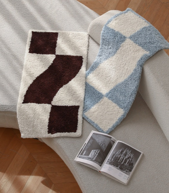 Checkered flocked home carpet in a minimalist living room with a soft grey and white pattern

