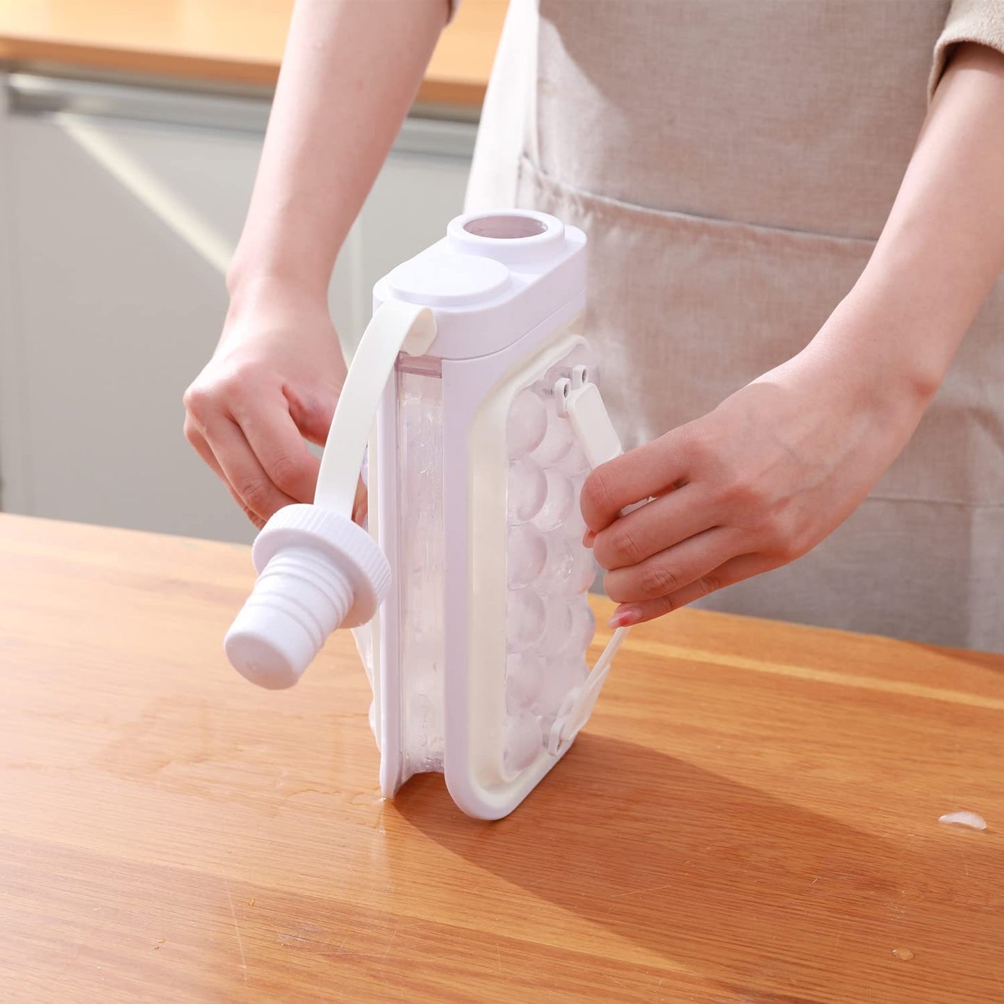 Portable ice ball kettle with quick release for summer drinks.