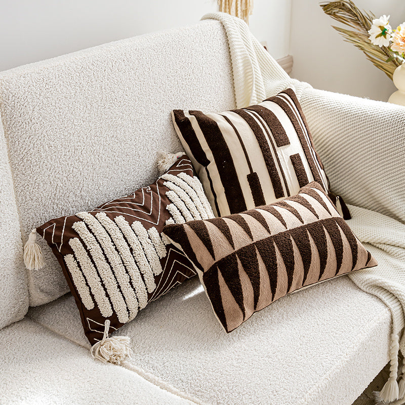 Nordic-style decorative cushion on a minimalist sofa with neutral tones

