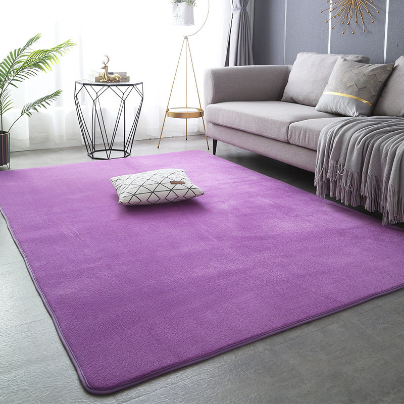 Modern minimalist coral fleece carpet in a bright living room with neutral-toned furniture and natural light

